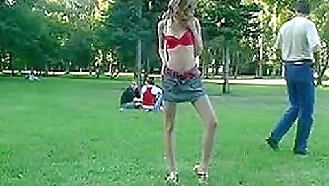 Young cutie pulls off red bra in the public