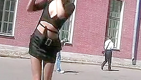 Russian blonde walks around and shows boobs in public