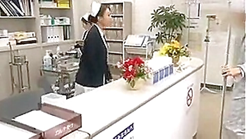Dutiful Japanese Nurse Services Patient in Public Hospital.