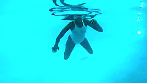 See-through white swimsuit in public pool