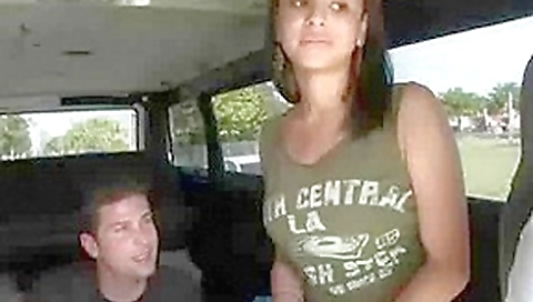 Stunning babe sitting topless in the BangBus