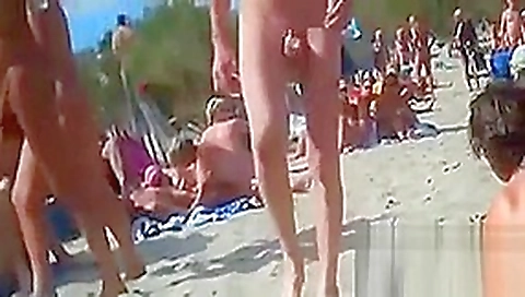 Swingers Having Fun Outdoors At A Beach