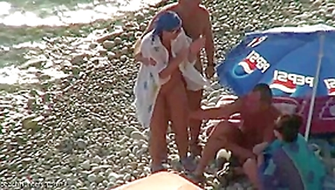 Real swingers at a nudist beach