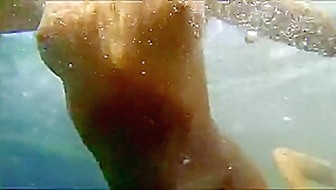 Nastka peeing into the sea