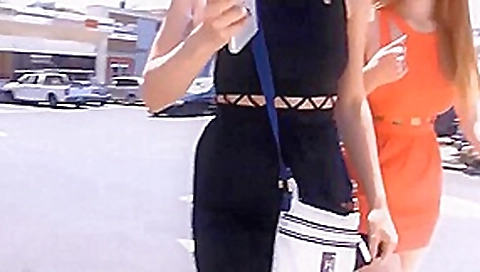 Girls defiles on the street showing off their asses