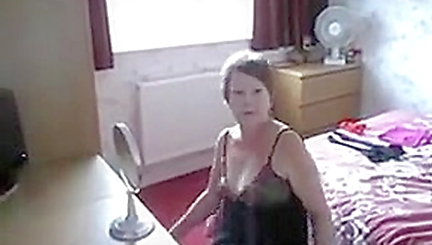 Sexy uk milf slut dressing in front of window Sexy uk milf slut dressing in front of window