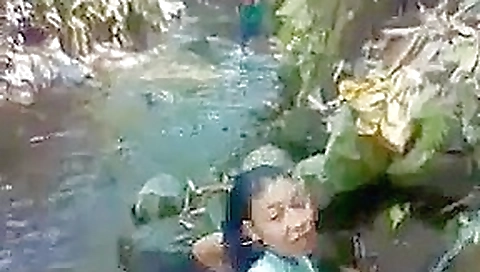 Indo malay bathing at a river