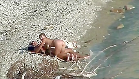 Couple fucking on a public beach, while walking past people