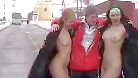 Two girls flashing in the snow