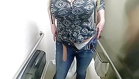 Big tit chick masturbates in public toilet