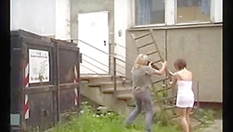 A master spanking his slave slut on the roof