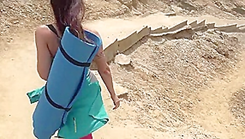 Sexy MILF shows us her goodies on the beach