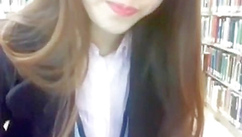 Riding red dildo on library